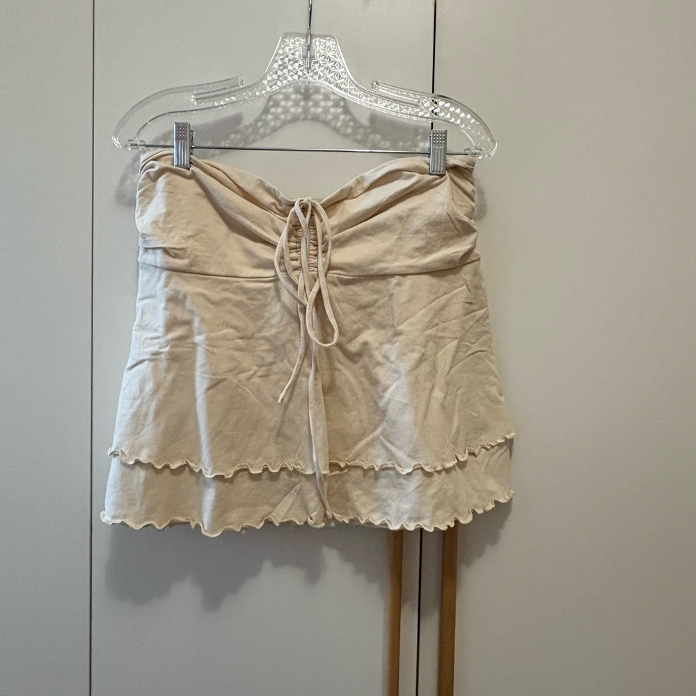 Women, large, cream colored, ruffled top top, layers, string